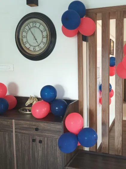 We place balloon bunches strategically to decorate the entire space.