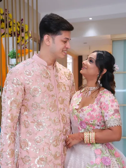 Capturing a sweet moment from this couple's engagement. I created a soft and romantic look for the bride-to-be, with a pink floral theme for her makeup and a delicate half-up hairstyle.