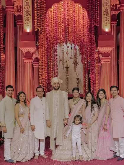 A beautiful family portrait of Tanya and Shivam with their loved ones after their wedding ceremony. It’s a simple, happy photo that represents the core idea that home is where your people are.