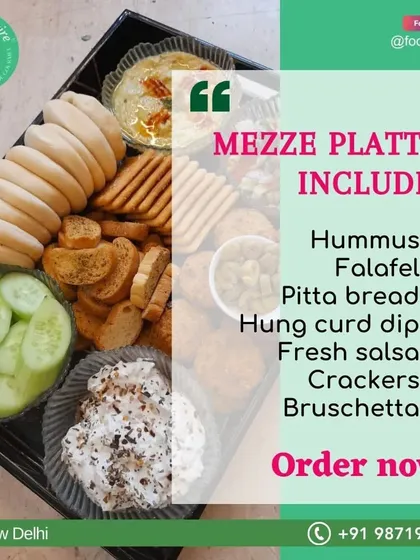 This Mezze Platter is perfect for house parties. It includes hummus, falafel, pitta bread, hung curd dip, fresh salsa, crackers, and bruschetta.