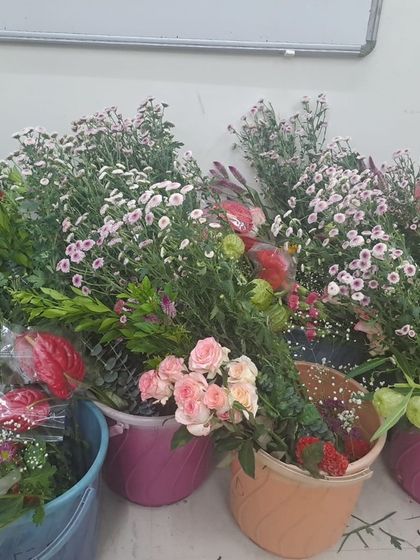 Buckets full of beautiful, fresh flowers ready for our Diwali Decoration Workshop. We ensure our students have a vibrant palette of blooms to choose from for their festive designs.