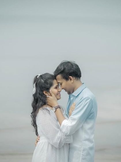 A tender forehead-to-forehead pose that beautifully captures the couple's deep connection and intimacy.