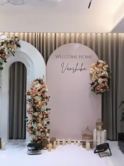 An elegant and clean welcome home decoration for baby Vanshika. I used beautiful pastel flower arrangements on modern white arch backdrops to create a sophisticated and warm welcome for the new mom and baby.