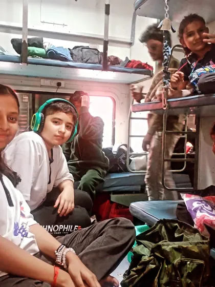 My students relaxing in their berths during the long train ride. It is a mix of rest, fun, and anticipation for the tournament ahead.