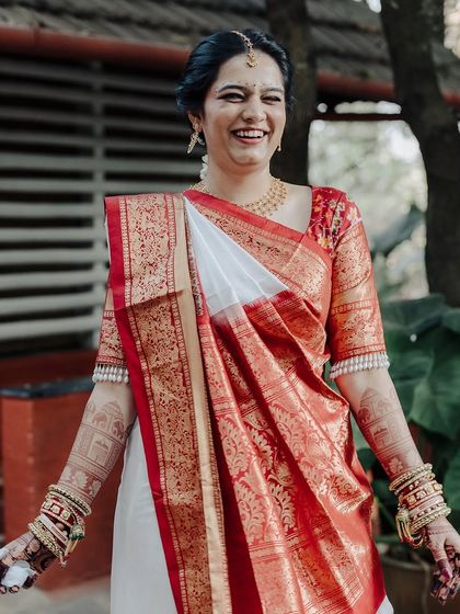 A candid shot of the bride's infectious laughter, a beautiful moment captured on her special day.