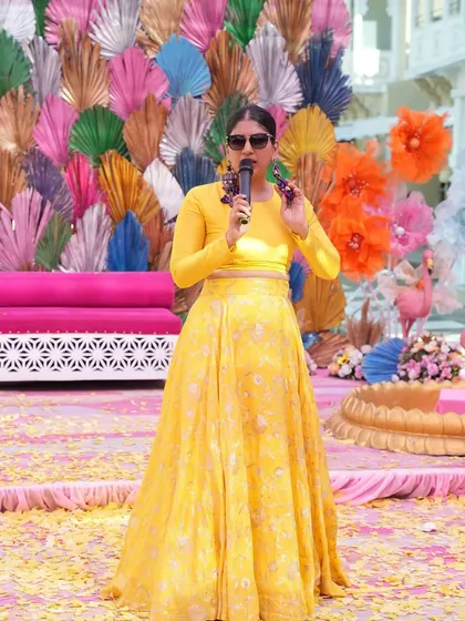 A solo shot of me on the colorful Haldi stage, ready for the madness to begin. The vibrant decor perfectly matched the event's energy.
