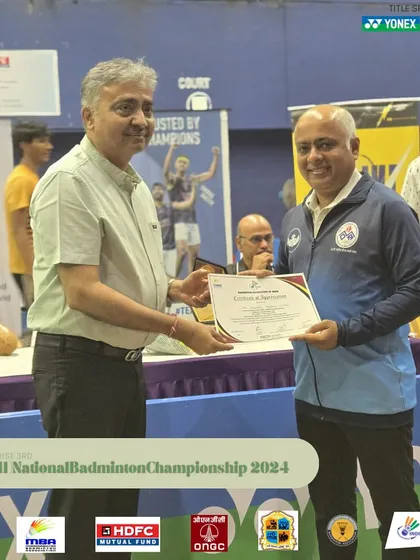 A senior umpire receiving his certificate. I value the experience that veteran officials bring to the court.