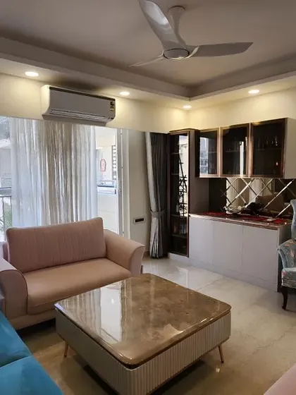 Another angle of the same living room, highlighting the bar and crockery unit in the corner. This shows how I integrate different functional zones into a cohesive and harmonious living and dining area.