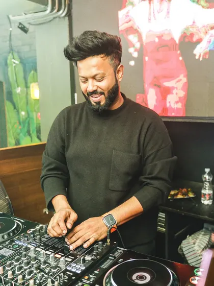 A candid moment of joy behind the decks.
