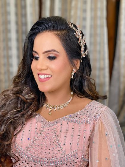 Aashi's Roka portrait. The makeup is soft and glowing, with a beautiful hair accessory adding a touch of sparkle.