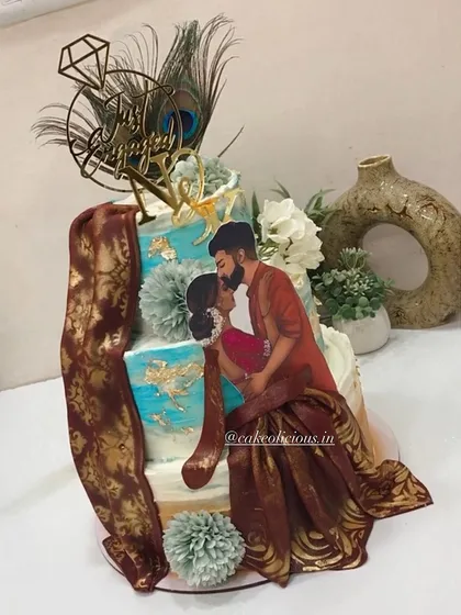 I had the honor of creating this divine Radha Krishna themed cake for an engagement. It features a beautiful illustration of the couple, peacock feathers, and a custom initial tag, all on a three-tier ganache cake.