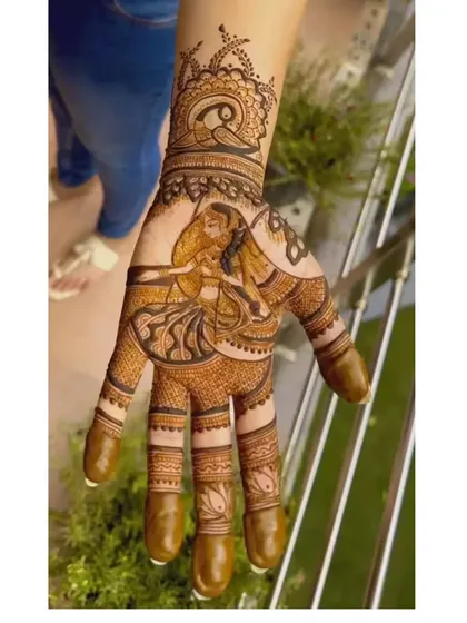 A single-hand bridal design featuring a graceful dancing figure. This style is perfect for brides who want a narrative element without covering the entire arm.