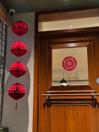 We decorated the entrance with red paper lanterns for Chinese New Year. It’s a special time of year for me, and I love sharing the festive spirit and traditions with everyone who visits.