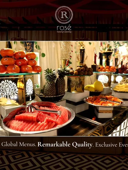 A wide shot of a fruit and dessert station, showcasing the abundance and remarkable quality of our global menus. We create exclusive events with meticulously designed details.