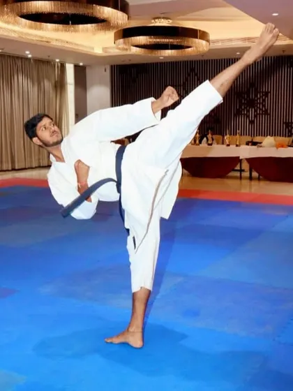 The beauty of karate lies in its technique. A demonstration of a perfectly executed high kick, a result of flexibility, balance, and countless hours of practice.