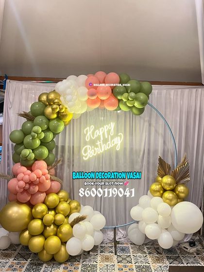 A beautiful ring decoration with a unique color palette. The olive green, peach, and white balloons are accented with gold for a sophisticated look.
