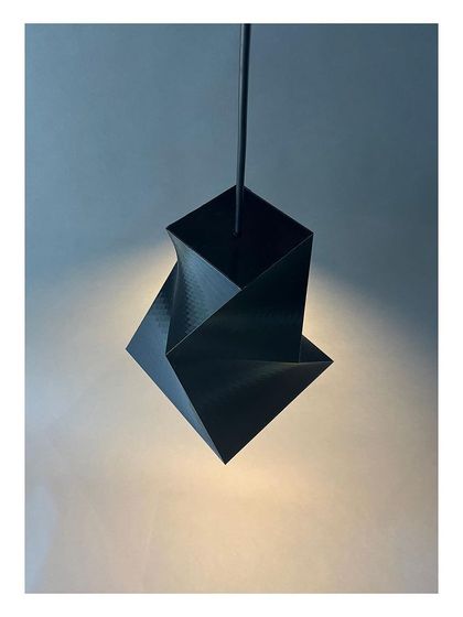 'Shifting Squares', a series of pendant lamps we designed and 3D-fabricated in our own MakerSpace. This exploration in digital fabrication and geometry demonstrates our hands-on approach to creating custom design elements for our projects.