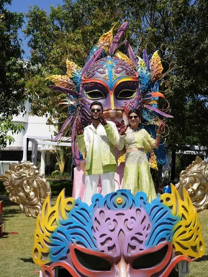 The couple posing for a photo on their grand carnival float, a perfect centerpiece for a fun-filled event.