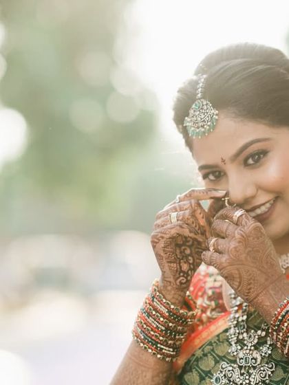 A happy bride sharing a candid moment during her Muhurtham ceremony.