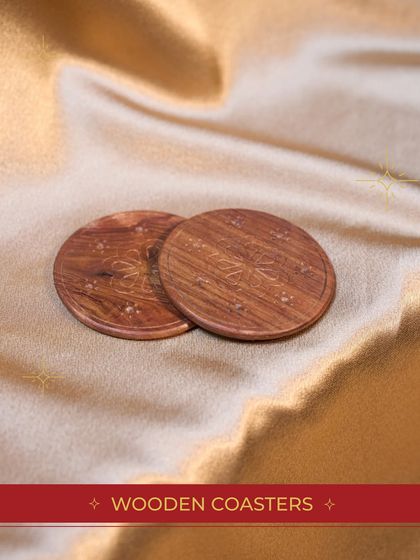 A close-up of the elegant wooden coasters included in our "Festive Bundle". It's the small, high-quality details that make a gift special.