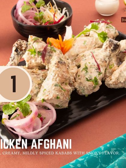 Our Chicken Afghani is a crowd favorite, featuring juicy, creamy, and mildly spiced kebabs with a smoky flavor from the tandoor. It's the first on our list of classic kebabs.