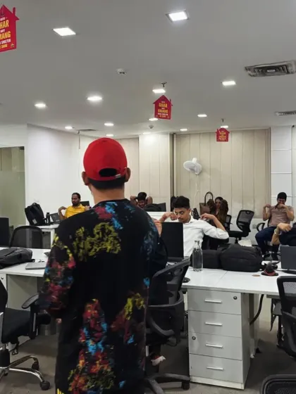 Leading an office session from the front. I ensure every participant understands the movements and their benefits, fostering an environment of learning and collective well-being.