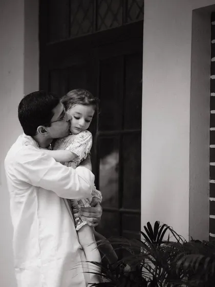 Sometimes the most powerful moments are the quiet ones. This black and white photograph of a father and daughter captures a tender, timeless bond that they will cherish forever.