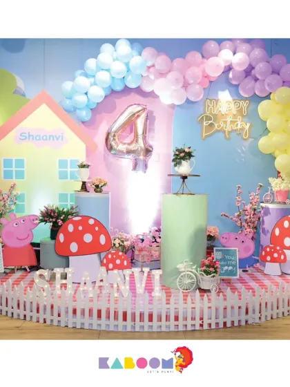 This whimsical Peppa Pig theme features a custom house backdrop, a white picket fence, and adorable mushroom props, creating a playful and picturesque setting for a fourth birthday.
