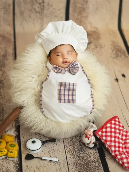 Cooking up some cuteness. This 'Little Chef' theme is an adorable idea for a milestone session, with a chef's hat, apron, and miniature kitchen props.
