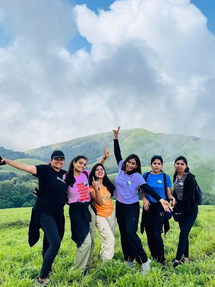 A group of friends having a great time on the beautiful meadows of the Bandaje trek. The perfect place for photos and making memories.