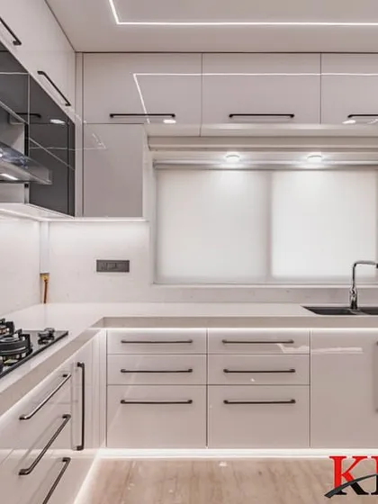 A wide view of the cooking and prep area, with ample counter space and bright, even lighting.