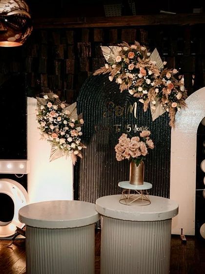 Celebrating a silver anniversary is a milestone that deserves a special touch. I designed this chic backdrop with modern arches, a balloon cascade, and marquee lights to create a stylish photo corner for the happy couple.