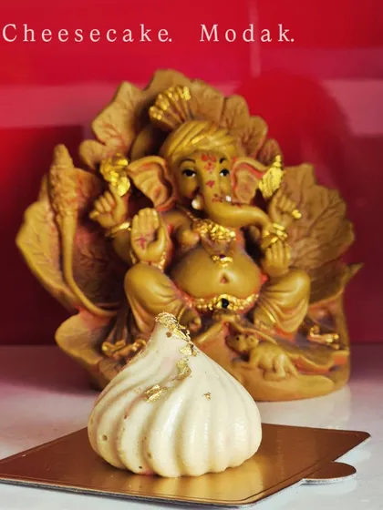 For Ganpati, I wanted to create something unique, so I made these Cheesecake Modaks. It's a modern twist on a traditional offering, with a creamy cheesecake filling inside a white chocolate shell. It’s my way of blending tradition with my love for baking.