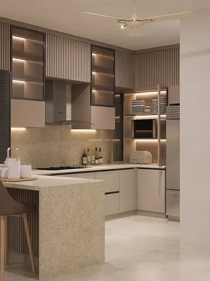 We believe kitchens must be both beautiful and highly functional. This modular kitchen design features a neutral palette, handleless cabinets, a breakfast bar, and smart lighting to make the space efficient and welcoming.