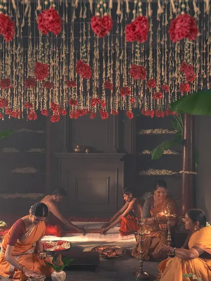 This wide shot shows the beautiful setup for the 'Little Rituals' campaign. The art direction, with the floral ceiling and kolam floor art, created a sacred space for the story of the bridal saree.