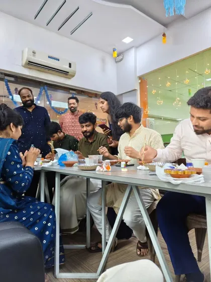 It’s all about shared moments. This candid shot shows team members enjoying the activity and each other's company during a special office event.