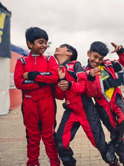 The future of our team. Our Micro drivers sharing a laugh in the paddock, building friendships and team spirit.