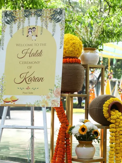 A cheerful welcome sign for a poolside Haldi ceremony, featuring cute illustrations and a bright yellow color scheme.