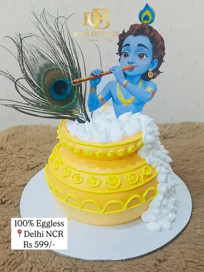 This cake was created for a Janmashtami celebration, featuring a detailed figurine of little Krishna emerging from a pot of butter. The design is complete with a real peacock feather, making it a divine centerpiece for the festival.