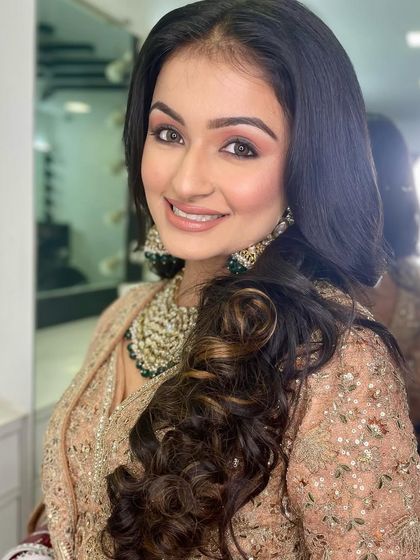 The smiling portrait shows how the makeup looks natural and radiant, not heavy. I teach techniques for creating comfortable, long-wearing makeup.