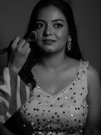 A behind-the-scenes moment of me adding the final touches. Even in black and white, her glow is undeniable.