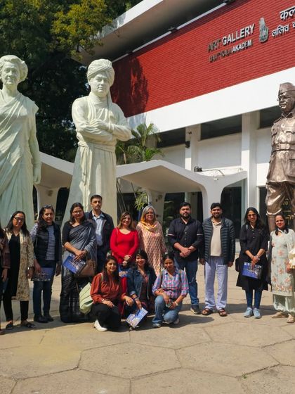 Our students gather for a photo at the Lalit Kala Gallery, in front of the iconic sculptures of Ram V. Sutar.
