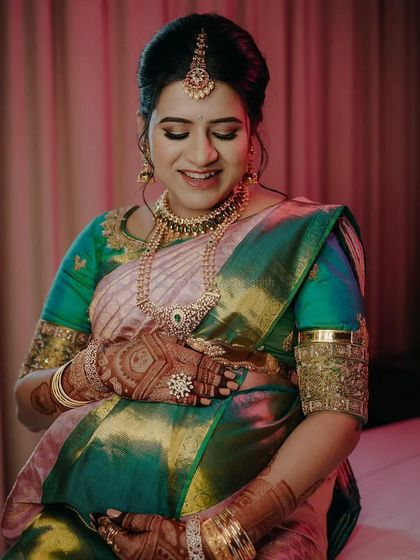 Another beautiful moment from Niharika's baby shower. Her makeup is soft and glowing, perfectly complementing her traditional attire and the happy occasion.