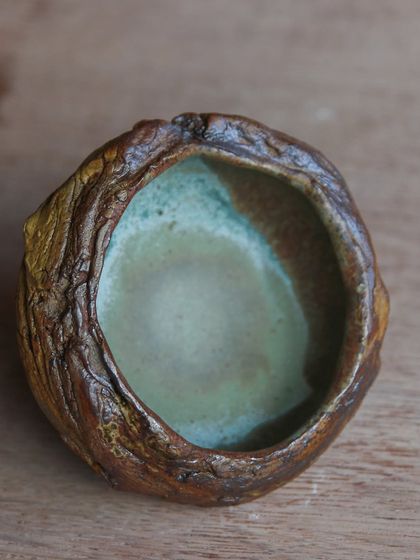 A textured, organic bowl created in a workshop where I explored new techniques like slamming clay for creases and using found objects for impressions.