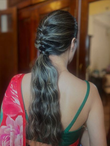 The final look, a chic and modern ponytail that is perfect for any occasion.