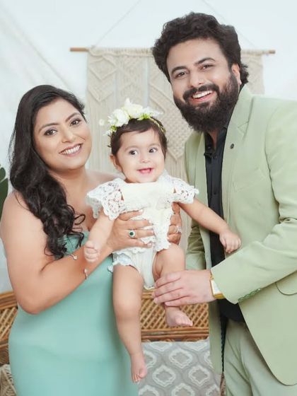 A happy family of three. I guide you into poses that feel natural and show your connection as a family.