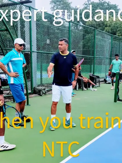 Expert guidance is key to player development. This image captures a moment of on-court strategy discussion between me and our players during a training session at NTC.