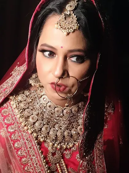 A candid moment capturing the bride's complete look. My goal is always to create a style that feels authentic to you, ensuring you look back at your photos and see the best version of yourself.