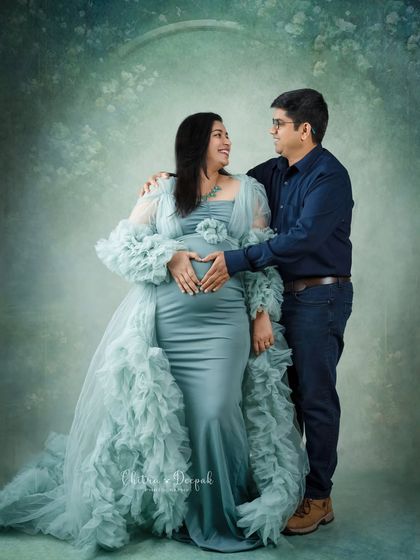 A heart for their baby. This classic pose where the couple forms a heart with their hands on the bump is a client favorite for a reason.