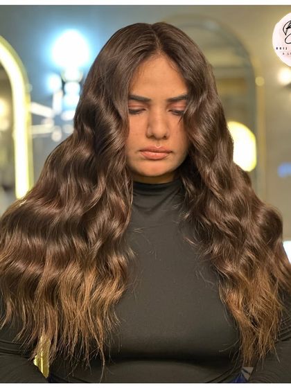 Another look at the stunning waves and deep color that transformed the client's look.